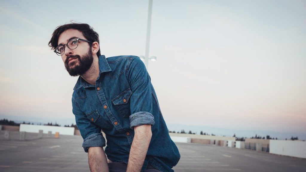 Millennial male wants to change the world blue jean button down