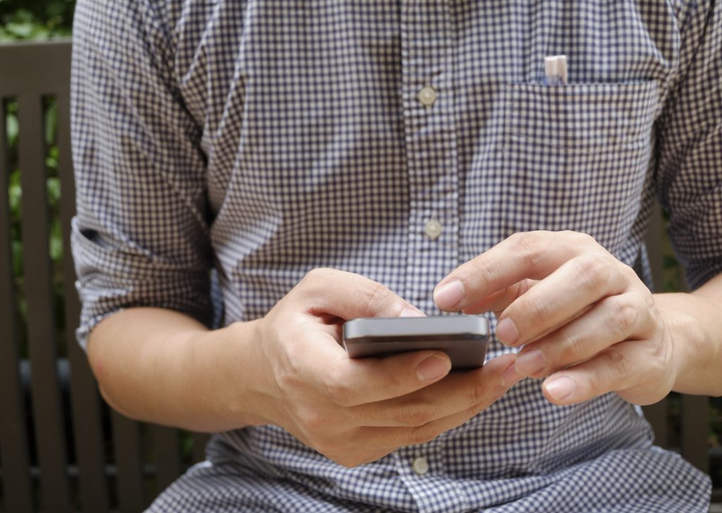 man using mobile smart phone