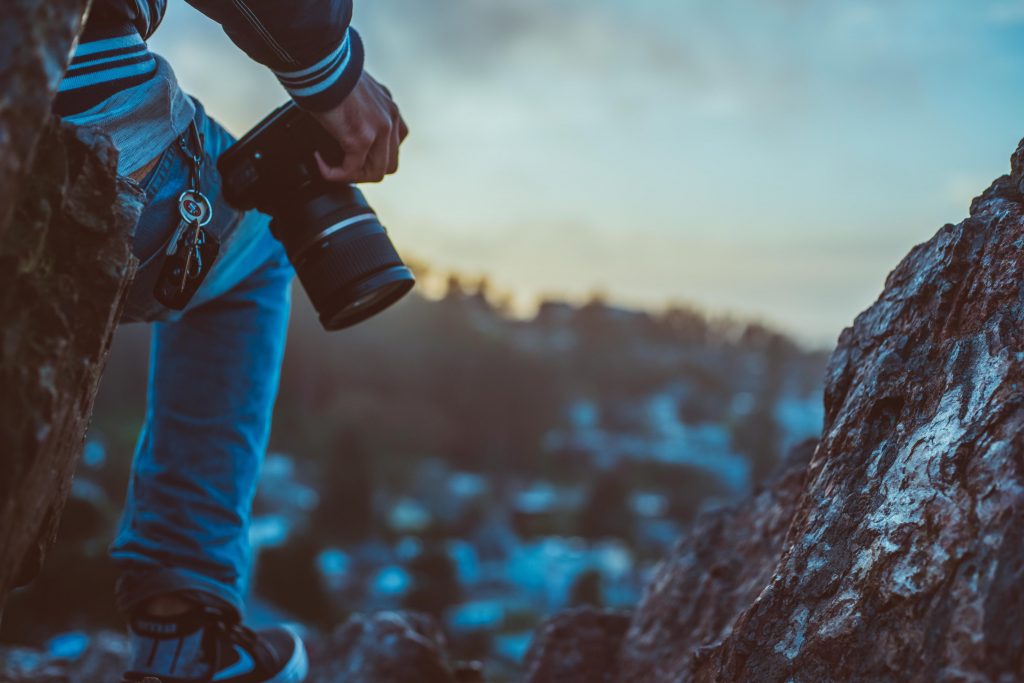 man-photogapher-on-mountain-passion-love