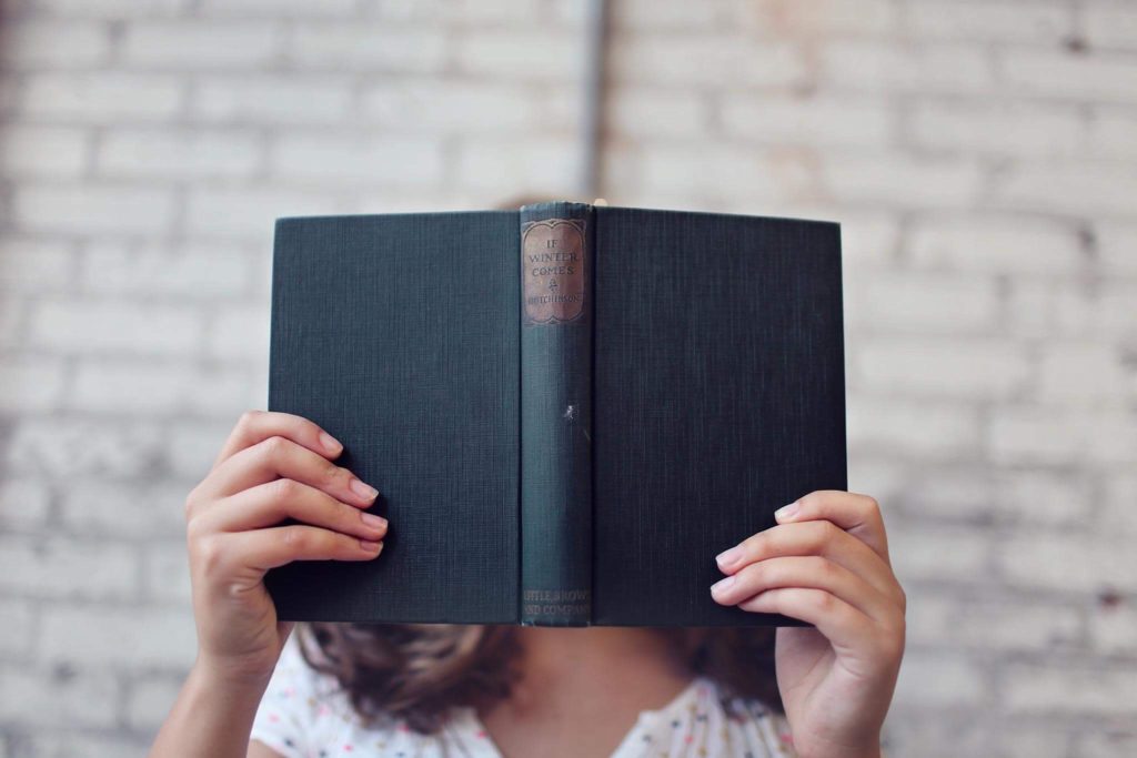 blur-girl-hands-books-reading-popular-articles