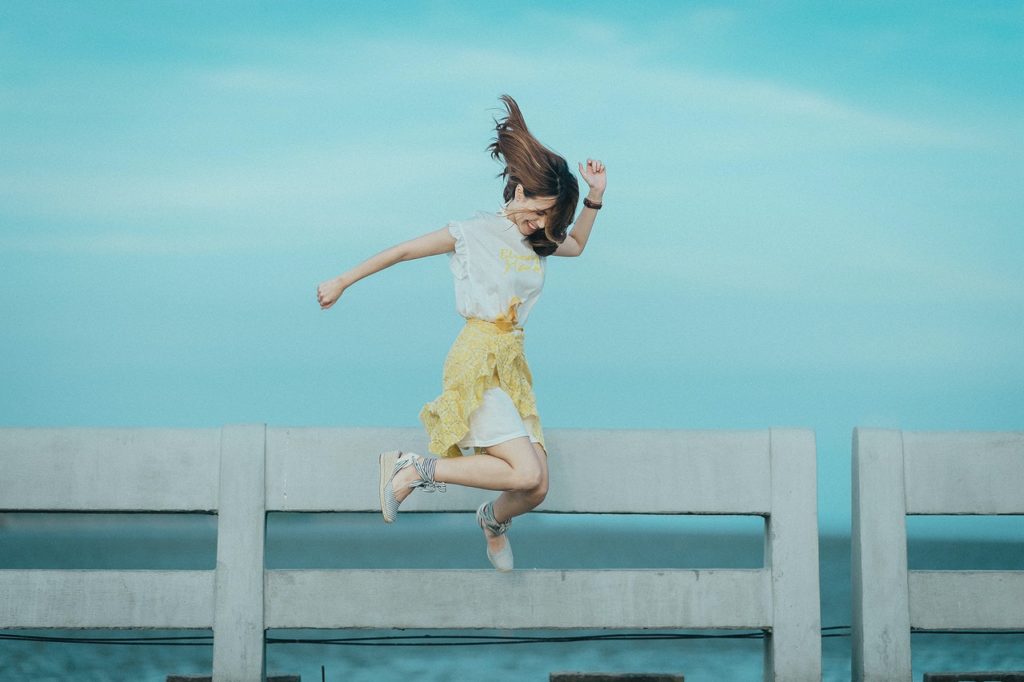 woman jumping having fun havng a life