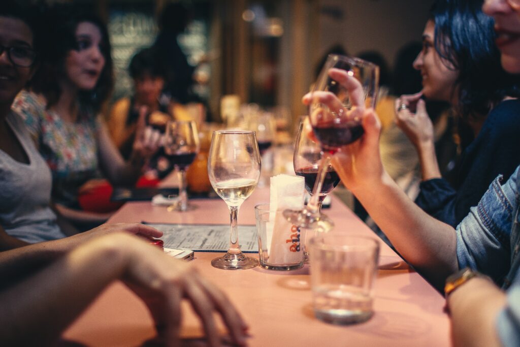 group of friends having dinner, drinking, what arguments are worth your time